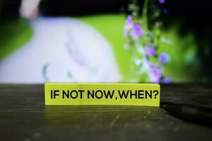 If Not Now, When on the sticky notes with bokeh background photo