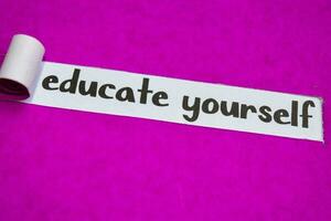 Educate Yourself text, Inspiration, Motivation and business concept on purple torn paper photo