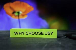 Why Choose Us on the sticky notes with bokeh background photo