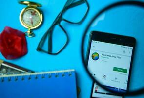 World Map Atlas 2019 dev app with magnifying on Smartphone screen. Map is a freeware web browser developed by Phoenix Labs photo