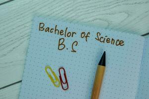 Bachelor of Science - B.S write on a book isolated on office desk. photo