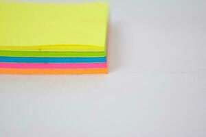 Close up colorful sticky notes isolated on white background. photo