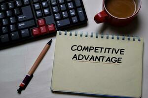 Competitive Advantage write on a book isolated on office desk. photo