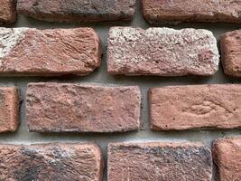 Background, texture of an old red brick wall. Studio Photo