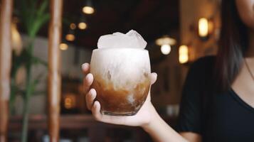 Glass of traditional vietnamese coconut ice coffee in woman hand. Illustration photo