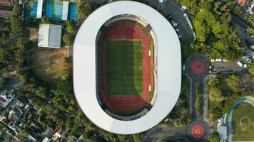 Aerial top down view of the Beautiful scenery of Manahan Solo Stadium. with cityscape background. Solo, Indonesia photo