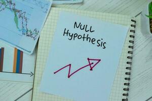 Concept of Null Hypothesis write on sticky notes isolated on Wooden Table. photo