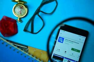 Intune Managed Browser dev app with magnifying on Smartphone screen. browser is a freeware web browser developed by Microsoft Corporation photo