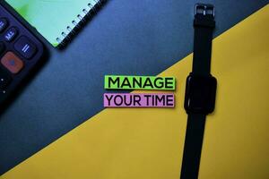 Manage Your Time text on top view color table background. photo