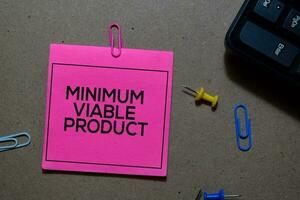 Minimum Viable Product write on sticky notes isolated on Office Desk photo