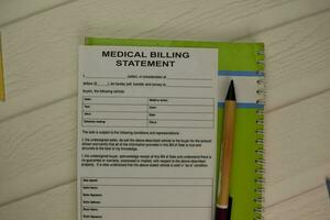 Medical Billing Statement form on a office desk. photo