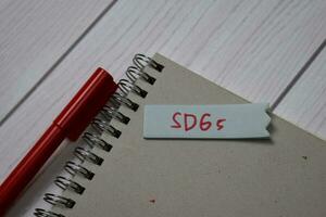 SDGs write on a book isolated on office desk photo