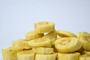 Close up slice yellow banana isolated on white background photo