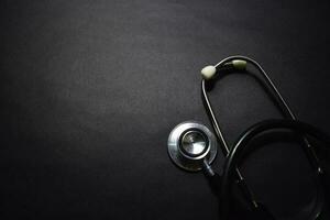Stethoscope isolated on black background. Healthcare Medical concept photo