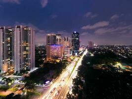 Aerial view of house building and city construction concept, evening outdoor urban view of modern real estate homes. Jakarta, Indonesia, January 23, 2023 photo