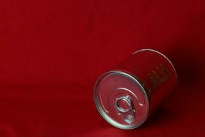 close up milk cans rolling in red background photo