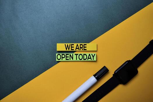 We Are Open Today text on top view color table background. photo