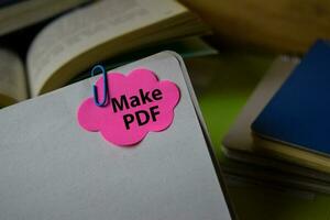 Make PDF write on a sticky note isolated on Office Desk. Business Document concept photo