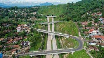 Aerial view of Cisumdawu Twin Tunnel Bandung City, Toll Gate and the Intersection which is the Beginning of the Cisumdawu Toll Road Section 1. Bandung, Indonesia, May 19, 2022 photo