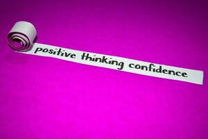 Positive thinking confidence text, Inspiration, Motivation and business concept on purple torn paper photo