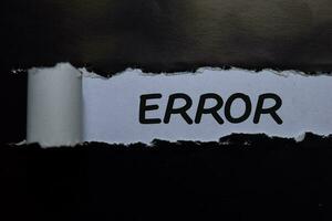 Error write on black and white torn paper photo