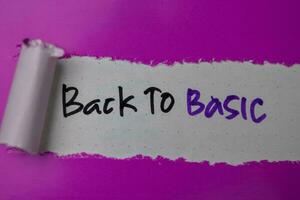 Back To Basic Text written in torn paper photo