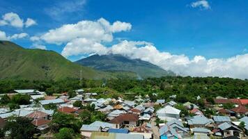 Aerial view of some agricultural fields in Sembalun. Sembalun is situated on the slope of mount Rinjani and is surrounded by beautiful green mountains. Lombok, Indonesia, March 22, 2022 photo