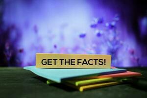 Get The Facts on the sticky notes with bokeh background photo
