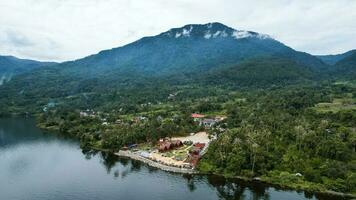 Aerial view of Danau Singkarak. Singkarak lake is one of the beautiful lake located in West Sumatera attracting thousands of tourists. Sumatra, Indonesia, January 25, 2023 photo