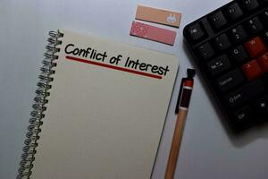 Conflict of Interest write on a book isolated on Office Desk photo
