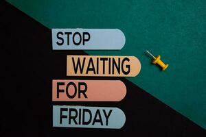 Stop Waiting For Friday write on a sticky note isolated on Office Desk photo