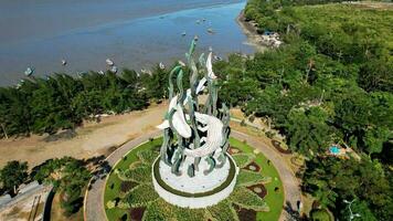 Aerial view of the A giant shark and crocodile statue as a symbol of the city of Surabaya. A landmark or monument as an icon of Surabaya city. East Java, Indonesia, August 28, 2022 photo