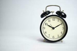 Clock ticking to 10 o'clock isolated on white background photo