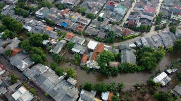 Aerial POV view Depiction of flooding. devastation wrought after massive natural disasters at Bekasi - Indonesia photo