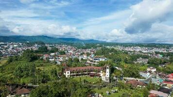 Aerial view of Traditional Minangkabau houses located in Bukittinggi, West Sumatra, Indonesia. Bukittinggi, Indonesia - January 25, 2023 photo