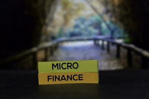 Micro Finance on the sticky notes with bokeh background photo