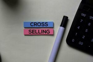 Cross-Selling text on sticky notes isolated on office desk photo