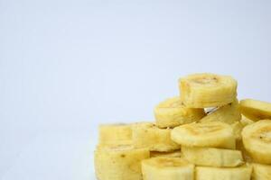 Close up slice yellow banana isolated on white background photo