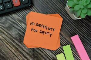 No Substitute For Safety write on sticky notes isolated on Wooden Table. photo