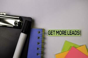 Get More Leads on sticky notes isolated on white background. photo