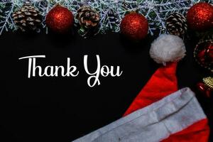 Thanks You text isolated on black backgroud. Frame of Christmas Decoration. photo