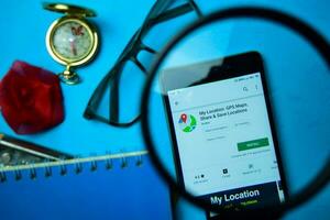 My Location GPS Maps, Share  Save Locations dev app with magnifying on Smartphone screen. GPS is a freeware web browser developed by Andev photo
