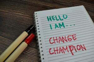 Hello I Am Change Champion write on a book isolated on the table. photo