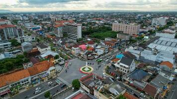 Aerial view of the tugu jogja or known as tugu pal is the iconic landmark of Yogyakarta. Central Java, Indonesia, December 6, 2021 photo