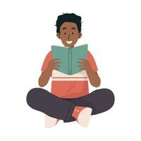 Boy reading a book while sitting on the floor vector