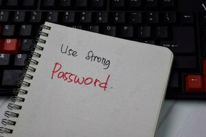 Use Strong Password write on a book isolated on keyboard computer photo