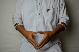 Close up Asian man shows hand gestures it means human emotion and expression isolated on white background photo