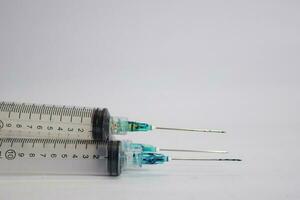 Close up of a syringe selective focus on numbers, isolated on white background photo