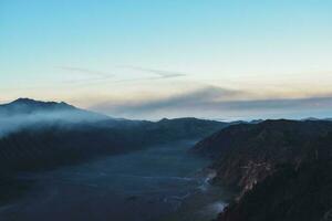 Beautiful colorful sunrise over Mount Bromo and wild island in Mount Bromo National Park photo