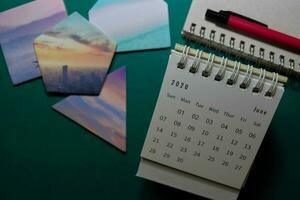 White Calendar June 2020 on office desk background photo